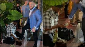‘Why film it?’ UFC star Conor McGregor splits opinion after showing himself getting shoeshine in Miami (VIDEO)