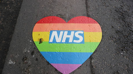 A rainbow heart in tribute to the NHS is seen painted onto the road outside Leighton Hospital - April 18, 2020