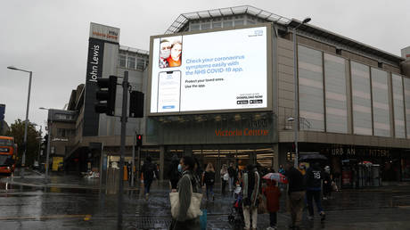 An ad for the NHS Covid-19 tracing app in Nottingham, UK, October 2020. © Darren Staples / AFP