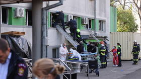 At least 9 killed as fire tears through Romanian hospital