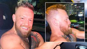 ‘I’m richer than the whole roster, b*tch’: McGregor brags he is wealthiest ever UFC fighter as he puffs cigarette topless in motor
