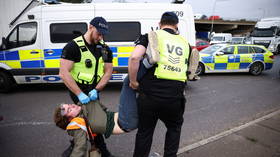 Furious motorists forcibly remove Insulate Britain eco warriors after protests block roads once more (VIDEOS)