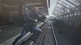 WATCH quick-thinking Moscow Metro train driver stop in SPLIT SECOND after man jumps onto tracks