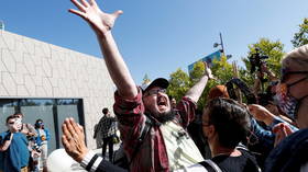 ‘I’m here to talk to his master’: Chappelle protesters & supporters clash during Netflix walkout demonstration