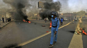 Sudanese police use tear gas as pro-military protesters try to block key roads in Khartoum 