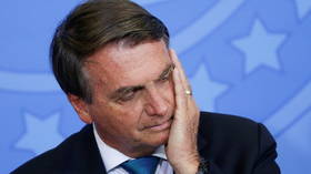 Brazilian senators vote to charge President Jair Bolsonaro with crimes against humanity for his handling of Covid pandemic