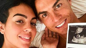 ‘Can’t wait to meet you’: Cristiano Ronaldo poses in bed with Georgina Rodriguez as power couple announce they are expecting twins