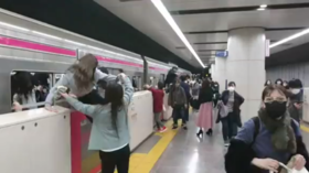 At least 10 people injured after attack in fire-hit Tokyo metro train, man with knife detained – reports