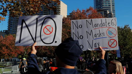 Anti-mandate protesters are shown demonstrating earlier this month in Boston.
