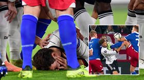 Shock and Gor: Horror as footballer is poleaxed by boot to his face on eventful night for first woman to ref Germany game (VIDEO)