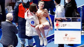 Fans shocked as figure skater Daria Usacheva is carried off after falling on the ice at Grand Prix (VIDEO)