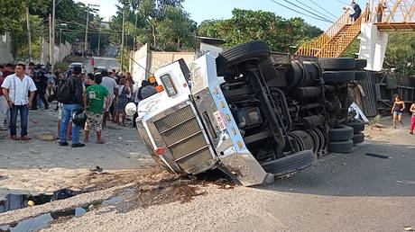 An overturned truck is seen after a trailer crash in the southern Mexican state of Chiapas killed at least 49 people, December 9, 2021