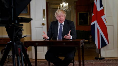 British Prime Minister Boris Johnson delivers an address to the nation, to provide an update on the Covid-19 booster vaccine at Downing Street, London, Britain, December 12, 2021.