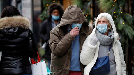 Christmas shoppers walk along New Bond Street, amid Covid-19 pandemic in London