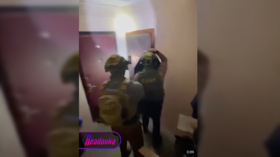 Armed police storm homes over social media comments (VIDEO)