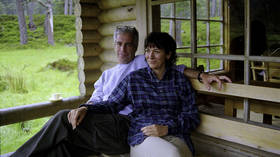 Epstein & Maxwell pictured lounging in Queen’s log cabin