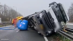 Corona crisis: Truck carrying beer flips on busy highway (VIDEO)