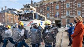 Police dress schoolchildren in riot gear & show how water cannon works