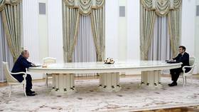 Reason for over-sized Macron-Putin table revealed