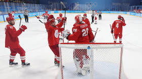 Russian hockey stars battle past Danes