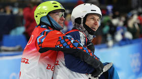 Defiant Ukrainian hugs Russian rival at Olympics