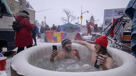 WATCH protesters soak in hot tub near country’s parliament