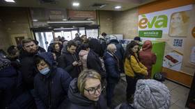 Panicked Ukrainians and Russians rush to ATMs