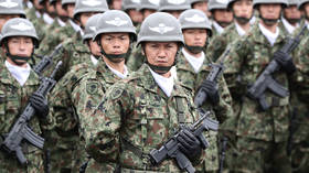 Japan discloses revised military plans