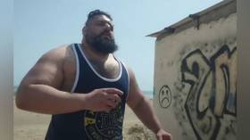 Iranian Hulk threatens lawsuit as he rejects rumors he pulled out of fight
