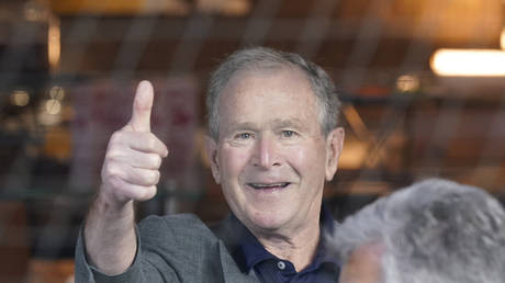 FILE PHOTO: Former President George W. Bush gives a thumbs-up before a baseball game in Arlington, Texas, May 1, 2022.
