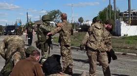 Ukrainian troops holed up in Mariupol begin surrendering