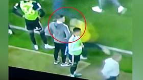 Fan arrested after sickening ‘headbutt’ on player during pitch invasion (VIDEO)