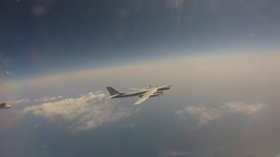 Russian and Chinese military planes conduct joint flyover