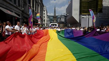 FILE PHOTO: Members of the LGBT community take part in the annual Pride Parade in London, Britain, July 7, 2018 © AFP / Tolga Akmen