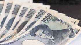 Japanese yen slides to record low
