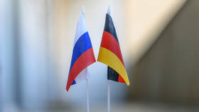 German Chancellor defends Merkel over Russia stance