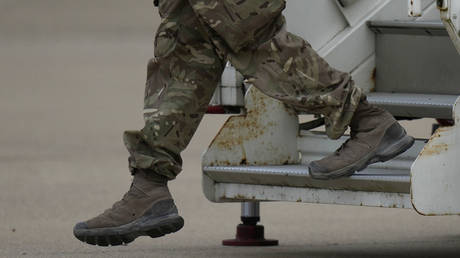FILE PHOTO. A member of the British armed forces returns from Kabul. ©Alastair Grant-WPA Pool / Getty Images