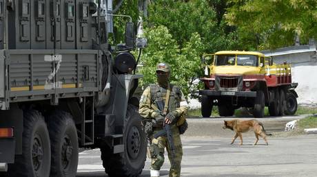A Russian soldier patrolling the streets of Kherson on May 20, 2022, Kherson, Ukraine