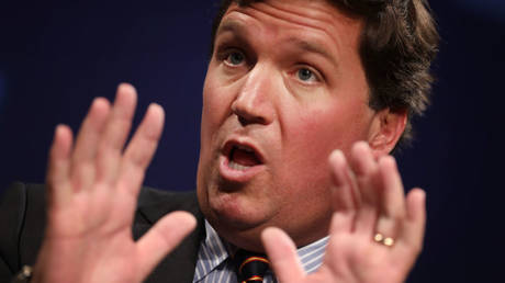 Fox News host Tucker Carlson is shown speaking at a March 2019 event in Washington.