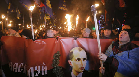 FILE PHOTO. Ukrainian nationalists carry torches and a banner with a portrait of Stepan Bandera, Kiev, Ukraine, January 1, 2015.