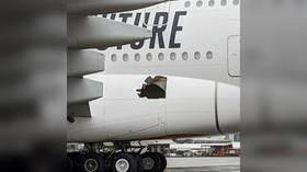 Passenger jet flies for 14 hours with huge hole