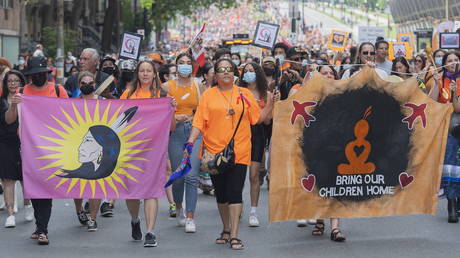 FILE PHOTO: People attend a gathering and march to honor Indigenous children, denounce genocide and demand justice for residential school victims in Montreal, Canada, July 1, 2021.
