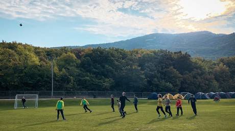 A group enjoying a game of football in Crimea. © RIA / Olesya Pechenkina