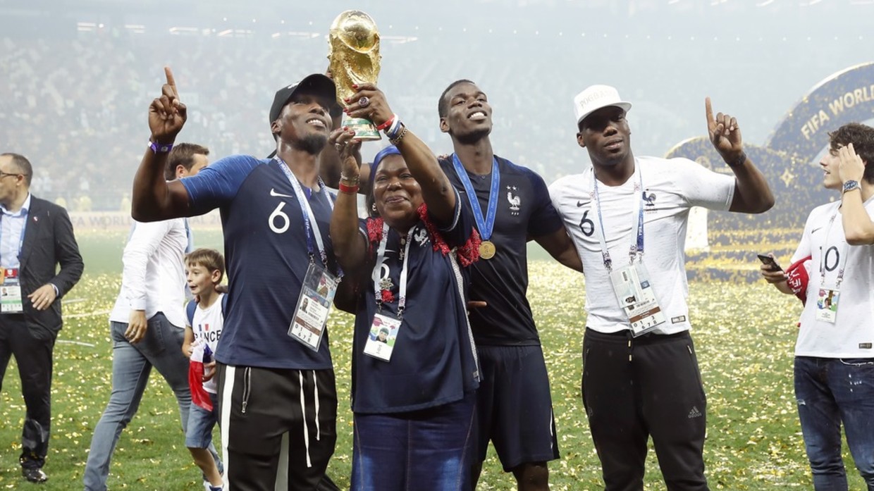 France's Paul Pogba, his mother Yeo and his brothers celebrate