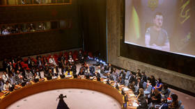 Barely audible Zelensky dodges Russian response at UN