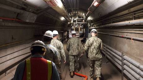 FILE PHOTO: US Navy and civilian water quality experts inspect the tunnels of the Red Hill Bulk Fuel Storage Facility, near Pearl Harbor, Hawaii, December 23, 2021