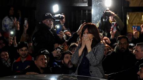 FILE PHOTO: Argentina's Vice-President Cristina Fernandez greets supporters demonstrating outside her residence in Buenos Aires on August 29, 2022