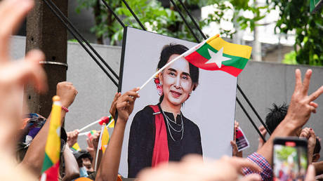 FILE PHOTO. Protesters seen holding a portrait of Aung San Suu Kyi during the demonstration.
