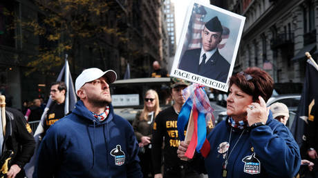 Families of soldiers who died by suicide are shown demonstrating during the November 2021 Veterans Day Parade in New York City.