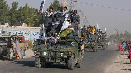 Newly recruited Taliban fighters parade in armoured vehicles after their graduation ceremony in the city of Herat on September 13, 2022,